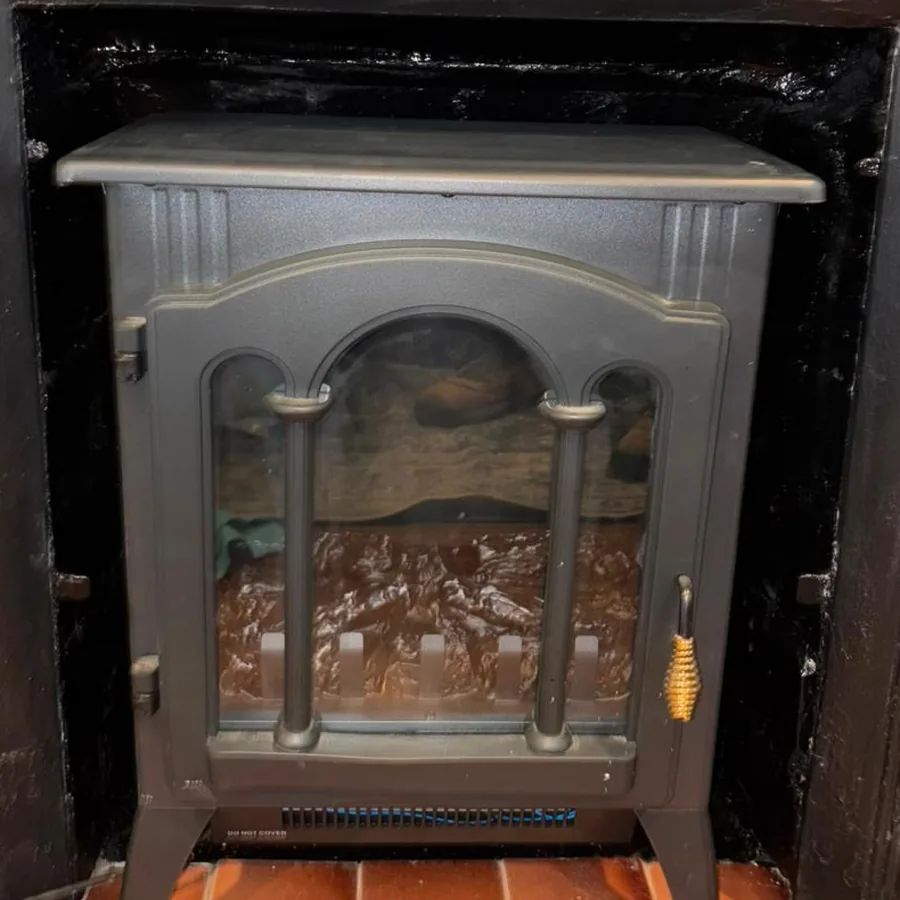Restored firebox fitted with a finished stove